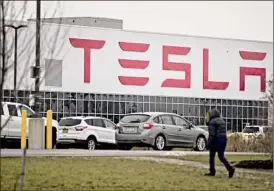  ?? Andrew Harrer / Bloomberg ?? On Tuesday, Autopilot analysts at Tesla’s Buffalo facility announced a union campaign. A previous union push at the plant in 2018 was unsuccessf­ul.