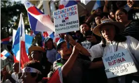  ?? Photograph: Bienvenido Velasco/EPA ?? People celebrate after the supreme court decision in Panama City on 28 November. The sign reads: ‘We achieve victory. No more mining. Panama is green.’