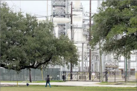  ?? JUAN LOZANO — THE ASSOCIATED PRESS ?? In this Thursday, Jan. 30, 2020, photo, Houston resident Guadalupe Ortiz takes her daily walk at a city park located across the street from her home and a Valero oil refinery. Houston’s lack of zoning has resulted in residents like Ortiz living next to petrochemi­cal facilities and businesses that handle hazardous substances.