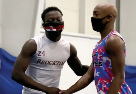  ?? NANCY LANE PHOTOS / HERALD STAFF ?? ‘FEELS GREAT’: Brockton’s Dourvens Bleus, left, is congratula­ted by South Hadley’s Jonas Clarke after his recordsett­ing 55-meter race time at the MSTCA Challenge track meet at Wheaton College in Norton on Tuesday.