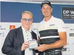  ??  ?? Henrik Stenson is presented with honorary life membership of the European Tour by chief executive Keith Pelley.