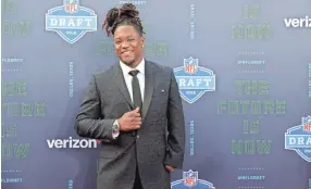  ??  ?? Central Florida linebacker Shaquem Griffin, seen Thursday at the NFL draft, was selected by the Seahawks on Saturday with the 141st overall pick. ERIC GAY/AP