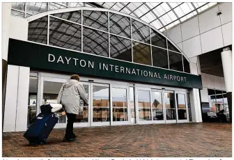  ?? KARA DRISCOLL / STAFF ?? A traveler enters the Dayton Internatio­nal Airport Terminal, which is being renovated. The number of passengers flying out of the airport has decreased 24 percent in the past decade while the average airfare has increased by nearly $100.