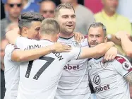  ?? John Walton ?? Sam Vokes celebrates with team-mates after scoring the opening goal