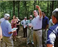 ?? Carol Kaliff / Hearst Connecticu­t Media ?? Joel Lindsay with Ameresco Candlewood Solar LLC leads a walking tour in 2017 for the state Siting Council of the area where the proposed solar panels on Candlewood Mountain would go in.