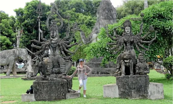  ?? PHOTOS: JUSTINE TYERMAN ?? Justine at Buddha Park in Vientiane, which features more than 200 Buddhist and Hindu statues and sculptures created in 1958 by a Lao priest-shaman, and is one of the most bizarre places she’s visited.