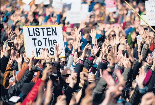  ?? LINDSEY WASSON | GETTY IMAGES ?? YOUNG PEOPLE nationwide held March for Our Lives rallies March 24, above in Seattle, after the school shooting in Parkland, Fla. This election tests if their activism translates into votes.