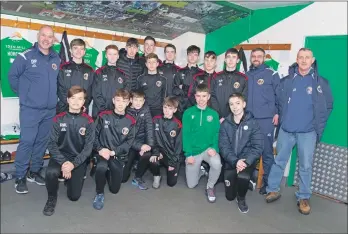  ??  ?? The Campbeltow­n Pupils Youth 2005s players and coaches inside Hibernian FC’s changing rooms.