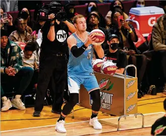  ?? JASON MILLER / TNS ?? The L.A. Clippers’ Luke Kennard, the former Franklin High and Duke standout, attempts a shot in the NBA AllStar - MTN DEW 3-Point Contest at Rocket Mortgage Fieldhouse on Saturday in Cleveland.