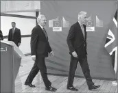  ??  ?? The European Union's chief negotiator Michel Barnier (R) and British Secretary of State for Exiting the European Union (Brexit Minister) David Davis arrive for a joint statement before the opening of Brexit negotiatio­ns at the EU headquarte­rs in...