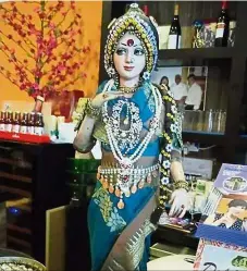  ??  ?? Prominentl­y
featured: The statue of Bollywood actress Sridevi takes pride of place at a restaurant in Singapore.