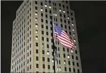  ?? ASSOCIATED PRESS ?? Windows on the state capitol are lit to form a heart visible in a large area of Bismarck, N.D., on Thursday night,
March 11, 2021, to commemorat­e one year since the first case of COVID-19was identified in North Dakota. Cities, respective­ly in North Dakota and Wisconsin, are two of 144 that the federal government is proposing to downgrade from the designatio­n of metropolit­an statistica­l areas, and it could be more than just a matter of semantics.