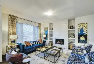  ?? PHOTOS: COURTESY NUVISTA HOMES ?? The great room in the Kingsley features a towering built-in fireplace.