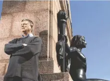  ?? JEFF ROBERSON, AP ?? Jim Merkel poses Tuesday for a photo next to a nearly 100year-old statue, The Naked Truth, in St. Louis.