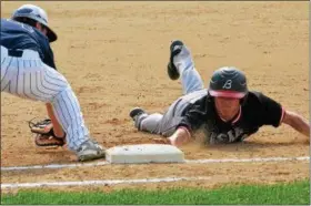  ?? THOMAS NASH - DIGITAL FIRST MEDIA ?? Boyertown’s Quinn Mason dives back to first on a pickoff attempt during the first inning Tuesday.