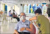  ??  ?? A senior citizen being inoculated at Swami Narayan Temple Vaccinatio­n Centre, Mahalaxmi, on Thursday.