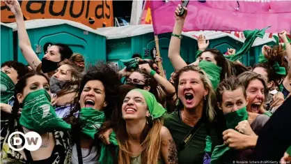  ??  ?? Hundreds of protestors, who had spent the night outside of the congress building in Buenos Aires, celebrated the landmark decision