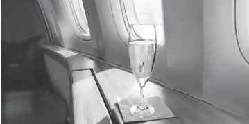  ??  ?? How upset would you be if an airline promised champagne service, then gave you a plastic cup full of sparkling wine?