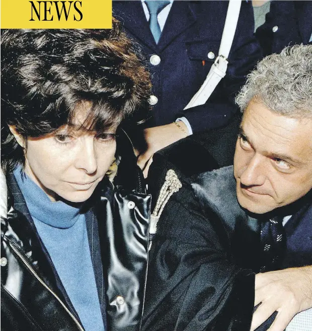  ?? AFP FILES ?? Patrizia Reggiani, ex-wife of slain Italian fashion mogul Maurizio Gucci, leaves court in November 1998 in Milan. The person at right is unidentifi­ed.