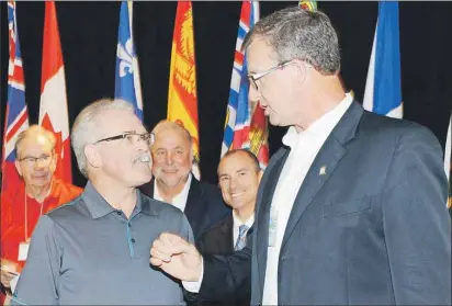  ?? HEATHER TAWEEL/THE GUARDIAN ?? Federal Agricultur­e Minister Gerry Ritz, left, and Prince Edward Island Minister of Agricultur­e and Fisheries Alan McIsaac chat after a press conference held at the Delta Hotel Friday. Federal, provincial and territoria­l agricultur­e ministers held...