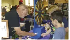  ??  ?? Kids love winning tumble-polished stones as Spinning Wheel prizes.