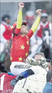  ?? JULIO CORTEZ — THE ASSOCIATED PRESS ?? Jockey Mike Smith reacts after guiding Justify to victory in the 150th running of the Belmont Stakes on Saturday.
