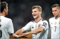  ?? MATTHIAS SCHRADER / AP ?? Timo Werner celebrates after scoring Germany’s fourth goal in Monday’s 6-0 thrashing of Norway in their European World Cup qualifying in Stuttgart.