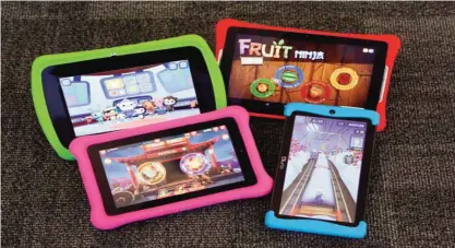  ??  ?? NEW YORK: Four kids’ tablets are displayed, Monday, Dec. 21, 2015, in New York. Clockwise, from upper left, are LeapFrog’s Epic, a Nabi Elev-8, Kurio’s Xtreme 2, and an Amazon Fire Kids Edition. As competitio­n has increased, kids’ tablets have come a...