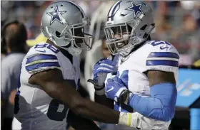  ?? PHOTO/ERIC RISBERG ?? Dallas Cowboys running back Ezekiel Elliott (right), celebrates on the sideline with wide receiver Dez Bryant after scoring a touchdown during the second half of an NFL football game against the San Francisco 49ers in Santa Clara on Sunday. AP