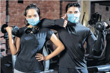  ?? 123RF STOCK IMAGE ?? Wearing a mask while at the gym isn’t a good idea, according to the World Health Organizati­on, but some Canadian researcher­s are now recommendi­ng masks be used.