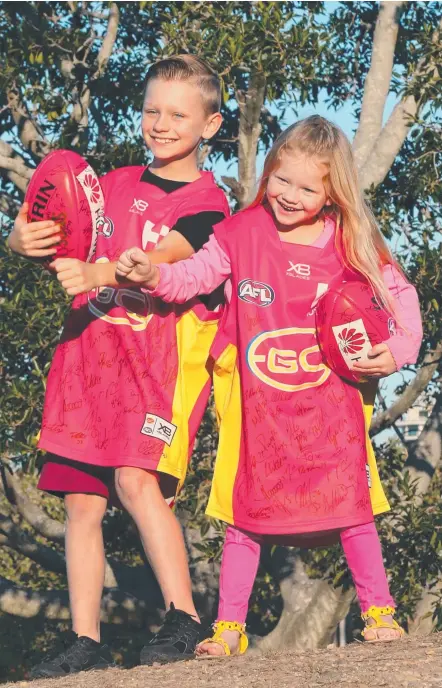  ?? Picture: MIKE BATTERHAM ?? Jet Quigley, 8, can take his little sister Grace to the Gold Coast Suns-Carlton match at Metricon Stadium this weekend thanks to the AFL club’s special offer with the Gold Coast Bulletin.