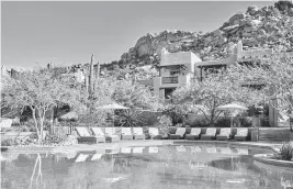  ?? FOUR SEASONS RESORT SCOTTSDALE A TNS ?? The two-tier, saltwater pool complex with views of Crescent Butte behind at the Four Seasons Scottsdale.