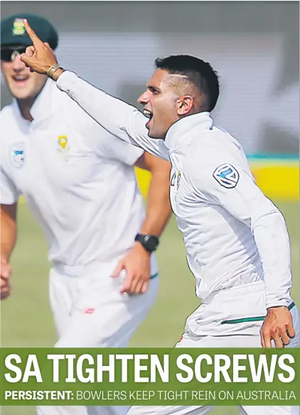  ?? Picture: AFP ?? JOB DONE. Proteas spinner Keshav Maharaj celebrates after taking the wicket of Australia’s Shaun Marsh during the first day of the first Test in Durban yesterday.