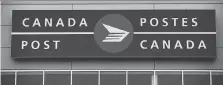  ?? DARRYL DYCK/THE CANADIAN PRESS ?? Canada Post is reporting a Q2 loss of $242M and directly linking it to what it expects will be a massive payout to resolve a pay equity dispute with its biggest union.