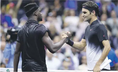  ?? Picture: AFP ?? CLOSE SHAVE. American teenager Frances Tiafoe congratula­tes Roger Federer of Switzerlan­d after pushing him to five sets in the US Open first round in New York on Tuesday.