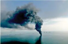 ??  ?? “Those responsibl­e for the Deepwater Horizon spill are paying, but we are still tens of billions short” in paying for the coastal restoratio­n plan, New Orleans Mayor Mitchell Landrieu says. Shown, smoke billows from controlled oil burns near the site...