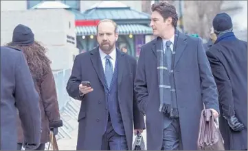  ?? JoJo Whilden Showtime ?? PAUL GIAMATTI, left, and Toby Leonard Moore are among the stars of the series set in f inancial industry.