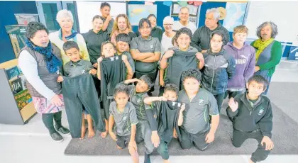  ?? Photos / Warren Buckland ?? Omahu School students receive bundles of thermals and track pants just in time for a cold Hawke’s Bay winter ahead.