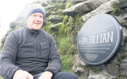  ??  ?? Gary Eccleston with the Princess Gwenllian plaque he has refurbishe­d at the summit of Snowdon