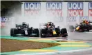  ?? Photograph: Bryn Lennon/Getty Images ?? Max Verstappen (centre) overtakes Lewis Hamilton in the wet on lap one of the Emilia Romagna F1 Grand Prix at Imola.