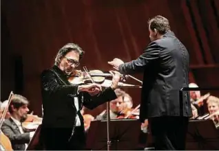  ?? ?? Le violoniste Leonidas Kavakos et Andris Nelsons, chef du Gewandhaus­orchester.