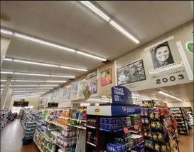  ?? Maegan Olmstead / Fort Morgan Times ?? A section of the history wall is displayed above the aisles at Edwards Right Price Market in Fort Morgan.