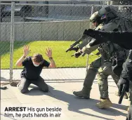  ??  ?? ARREST His gun beside him, he puts hands in air