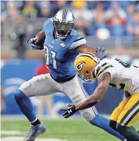  ?? RAJ MEHTA/USA TODAY SPORTS ?? Former Lions wide receiver Calvin Johnson stiff-arms Packers strong safety Morgan Burnett during a 2015 game.