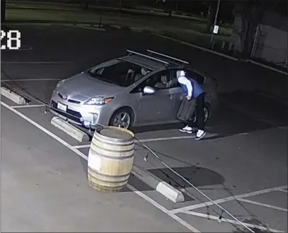  ?? BYRON HETHERTON — CONTRIBUTE­D ?? Security footage from The Commons in Chico shows an unknown person breaking into the vehicle of co-owner Byron Hetherton on Feb. 11 in Chico.