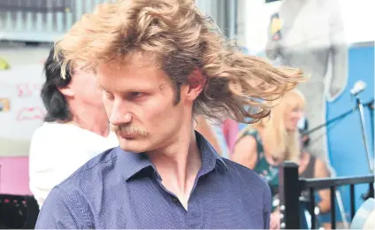  ?? Picture: AFP ?? THE MANE MAN. A contestant shows off his mullet haircut at Mulletfest 2018 in the town of Kurri Kurri, 150km north of Sydney, Australia, at the weekend. The event is a celebratio­n of the iconic haircut.