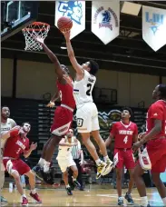  ?? Photo by David Silverman / Bryant Athletics ?? Bryant freshman guard Erickson Bans, of Pawtucket, played a season-high 39 minutes and scored a season-high 14 points in Saturday’s NEC semifinal win over Sacred Heart.