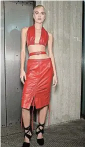  ?? ?? An ultra sexy red leather dress from Andredamo shows off a bare midriff.