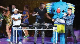  ?? AFP ?? Jamaica’s former sprinter Usain Bolt performs next to the mascot Borobi during the closing ceremony of the 2018 Commonweal­th Games. —