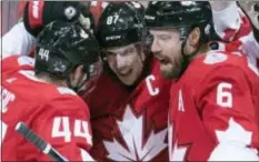  ?? FRANK GUNN — THE CANADIAN PRESS VIA AP ?? Team Canada center Sidney Crosby (87) is congratula­ted by teammates Marc-Edouard Vlasic (44) and Shea Weber (6) after scoring on Russia during the first period of a World Cup of Hockey semifinal game, Saturday in Toronto.